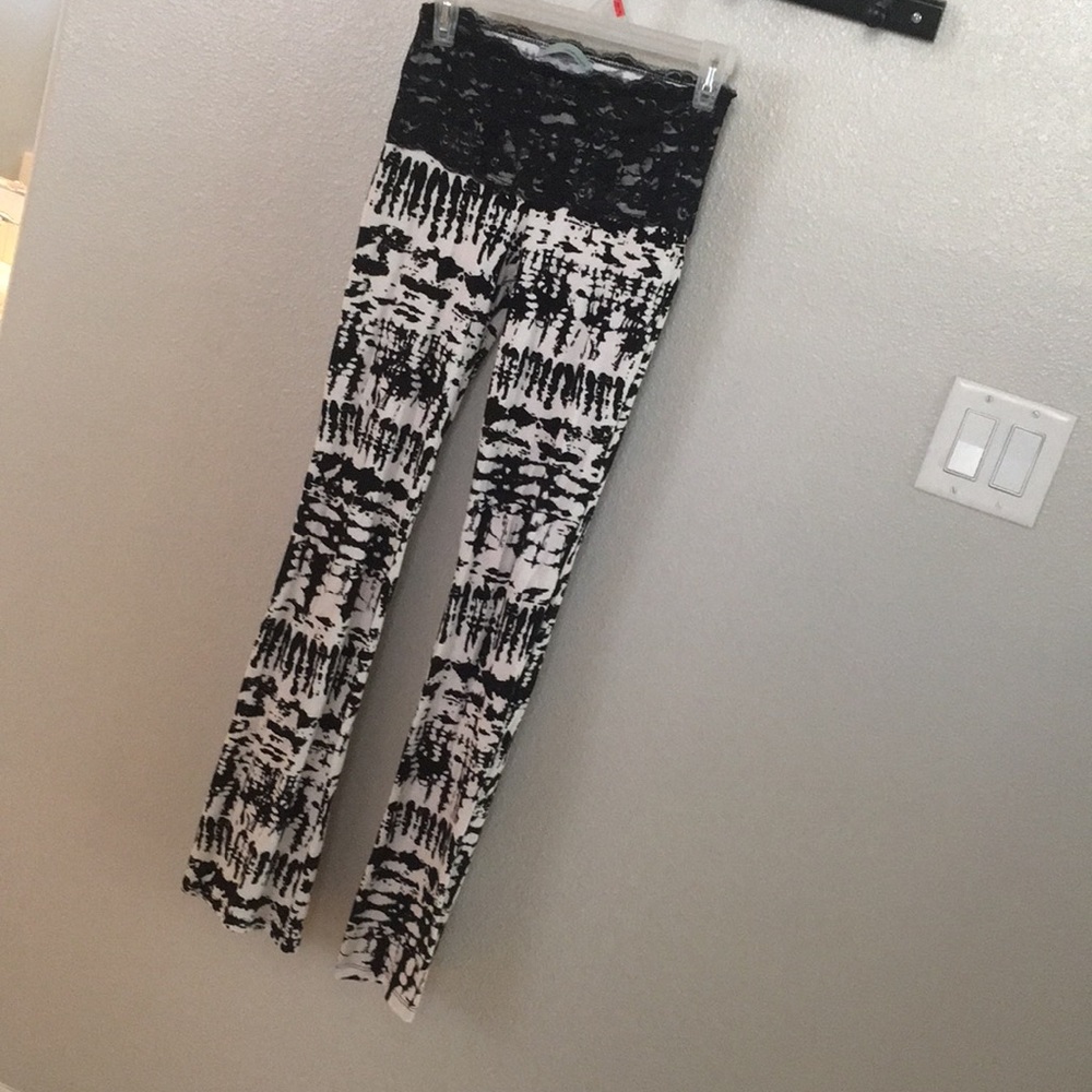 Black/white legging pants with lace trim. NWOT